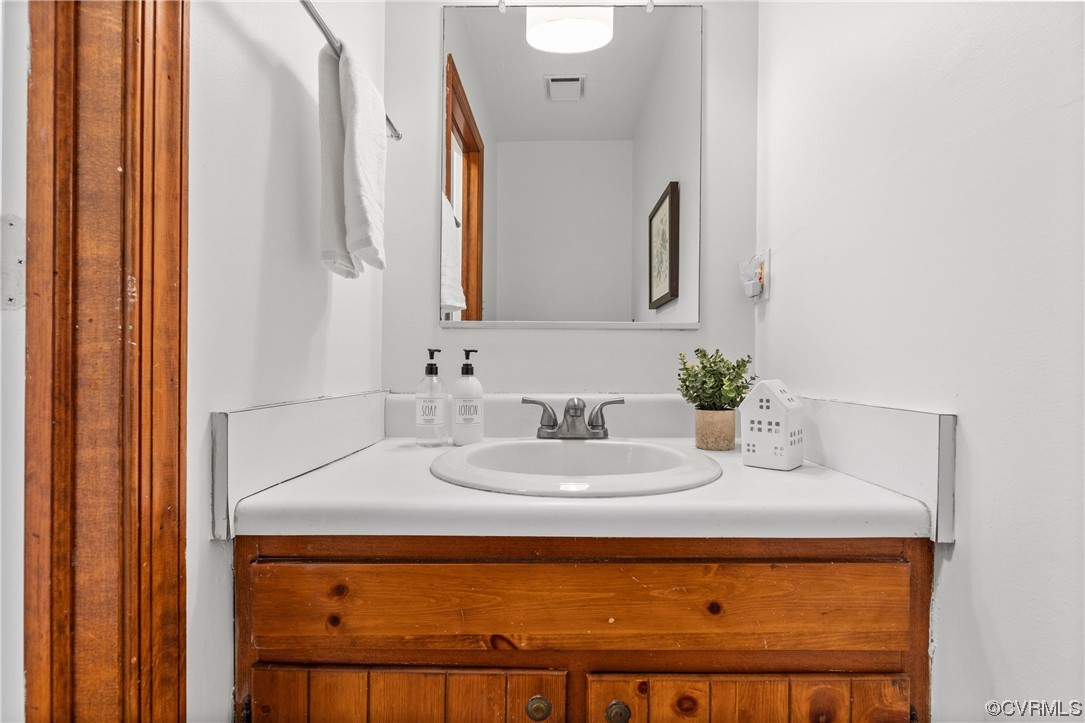 14804 Acorn Ridge Place Midlothian, VA 23112 - Photo 19 of 42 a bathroom with a sink and a mirror
