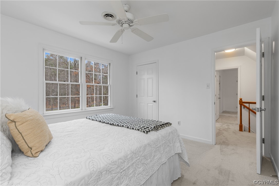 14804 Acorn Ridge Place Midlothian, VA 23112 - Photo 27 of 42 a bedroom with a bed and closet