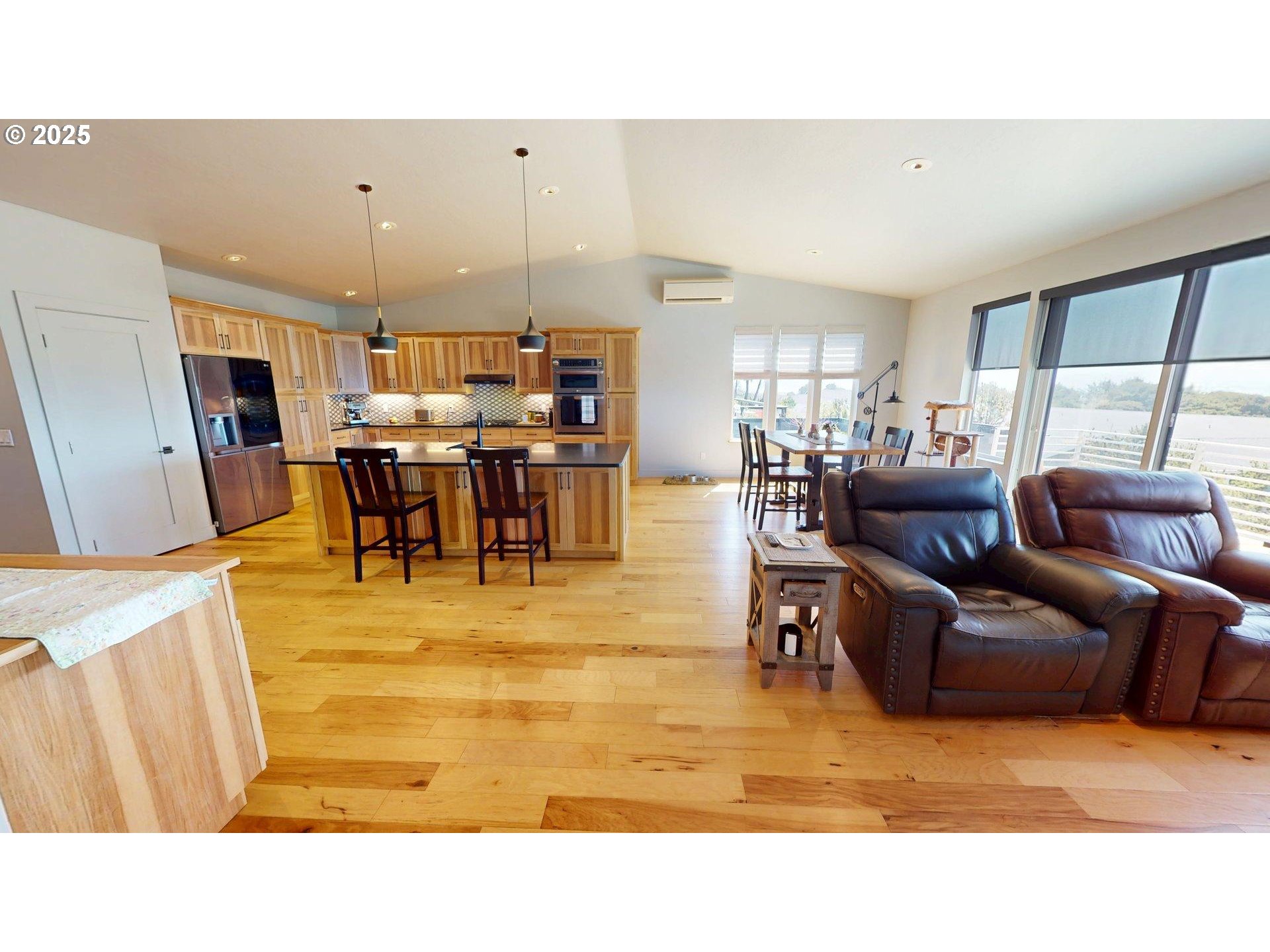 30420 Sawyer Way Gold Beach, OR 97444 - Photo 15 of 47 a living room with furniture and a dining table