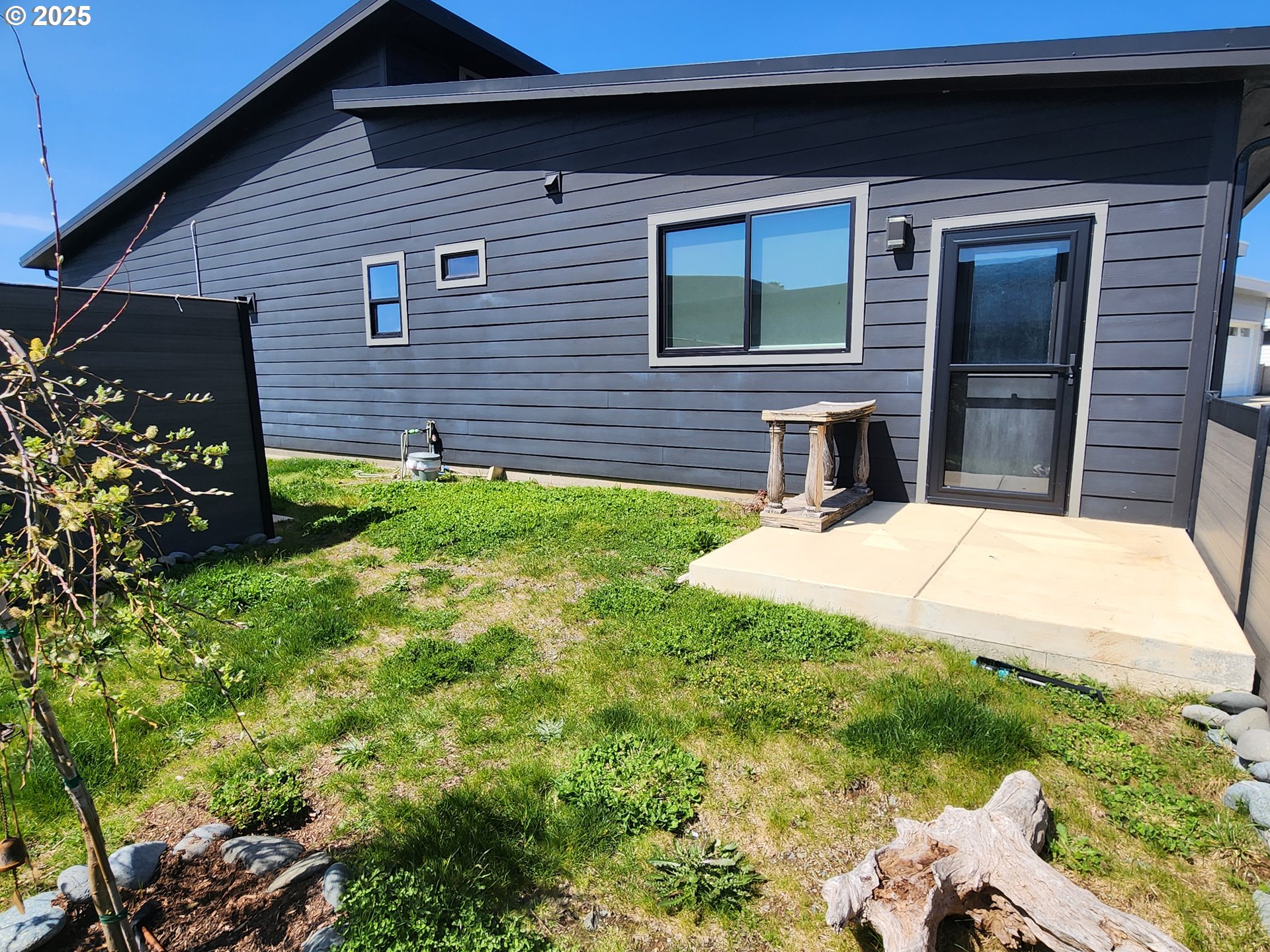 30420 Sawyer Way Gold Beach, OR 97444 - Photo 16 of 47 a view of house with backyard and glass windows