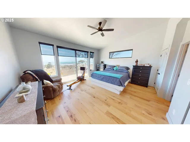 a living room with a bed and a dresser