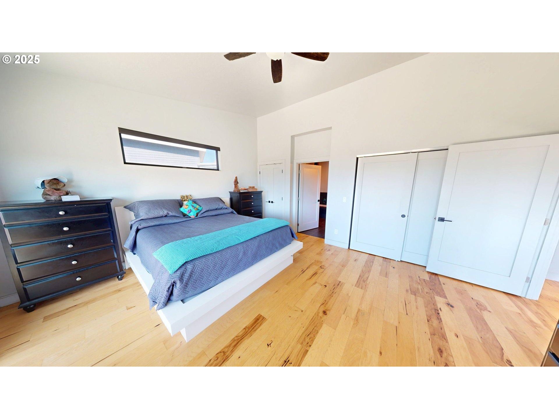 30420 Sawyer Way Gold Beach, OR 97444 - Photo 20 of 47 a living room with a bed and a dresser