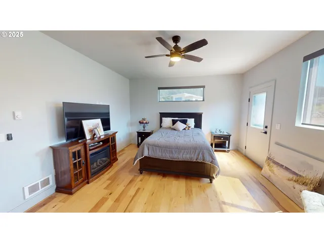 a living room with a bed and furniture