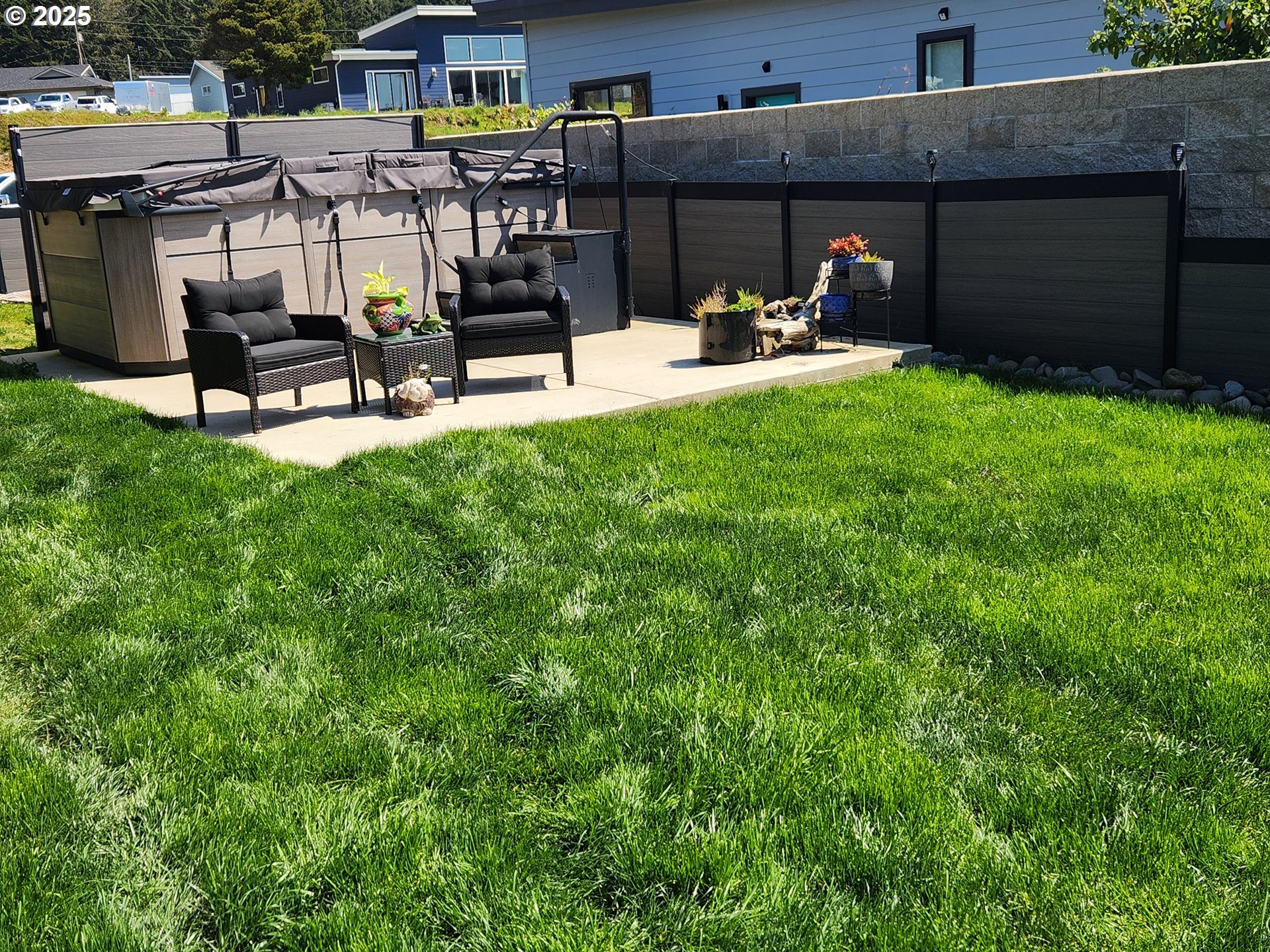 30420 Sawyer Way Gold Beach, OR 97444 - Photo 34 of 47 a view of a backyard with sitting area and slide