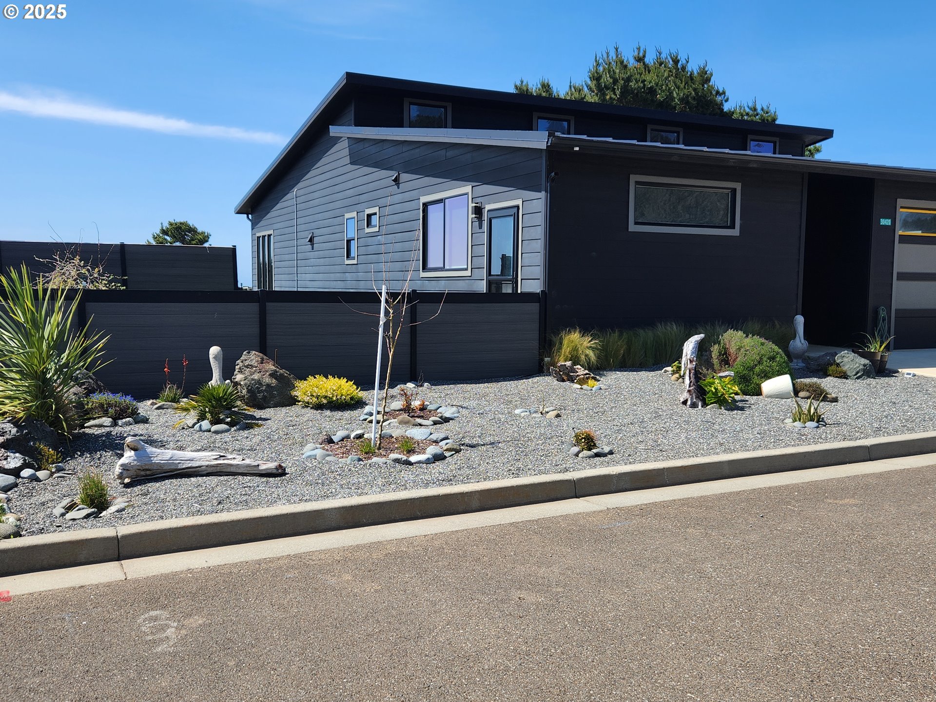 30420 Sawyer Way Gold Beach, OR 97444 - Photo 39 of 47 a front view of a house with a yard