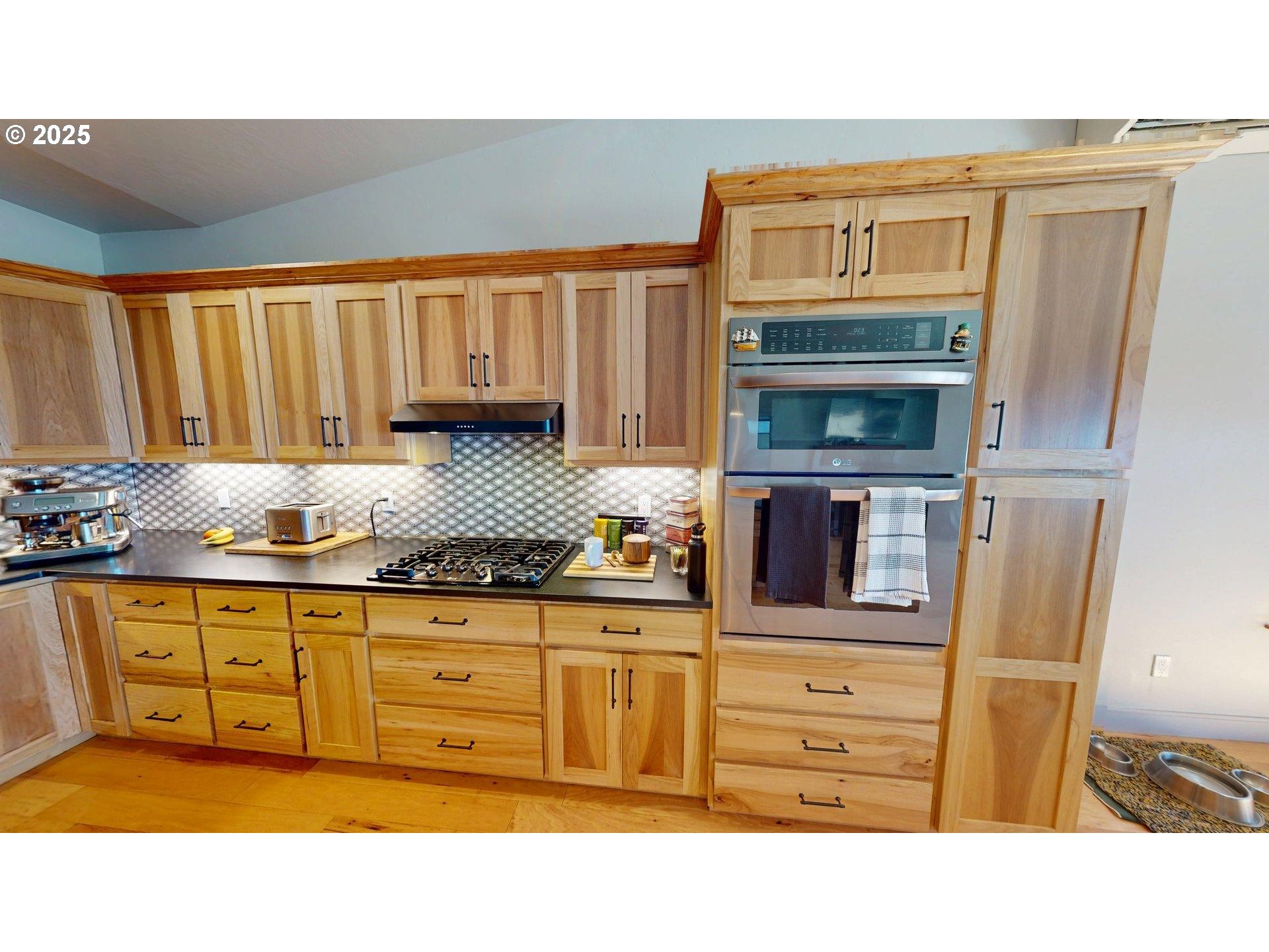 30420 Sawyer Way Gold Beach, OR 97444 - Photo 9 of 47 a kitchen with stainless steel appliances granite countertop a stove and cabinets