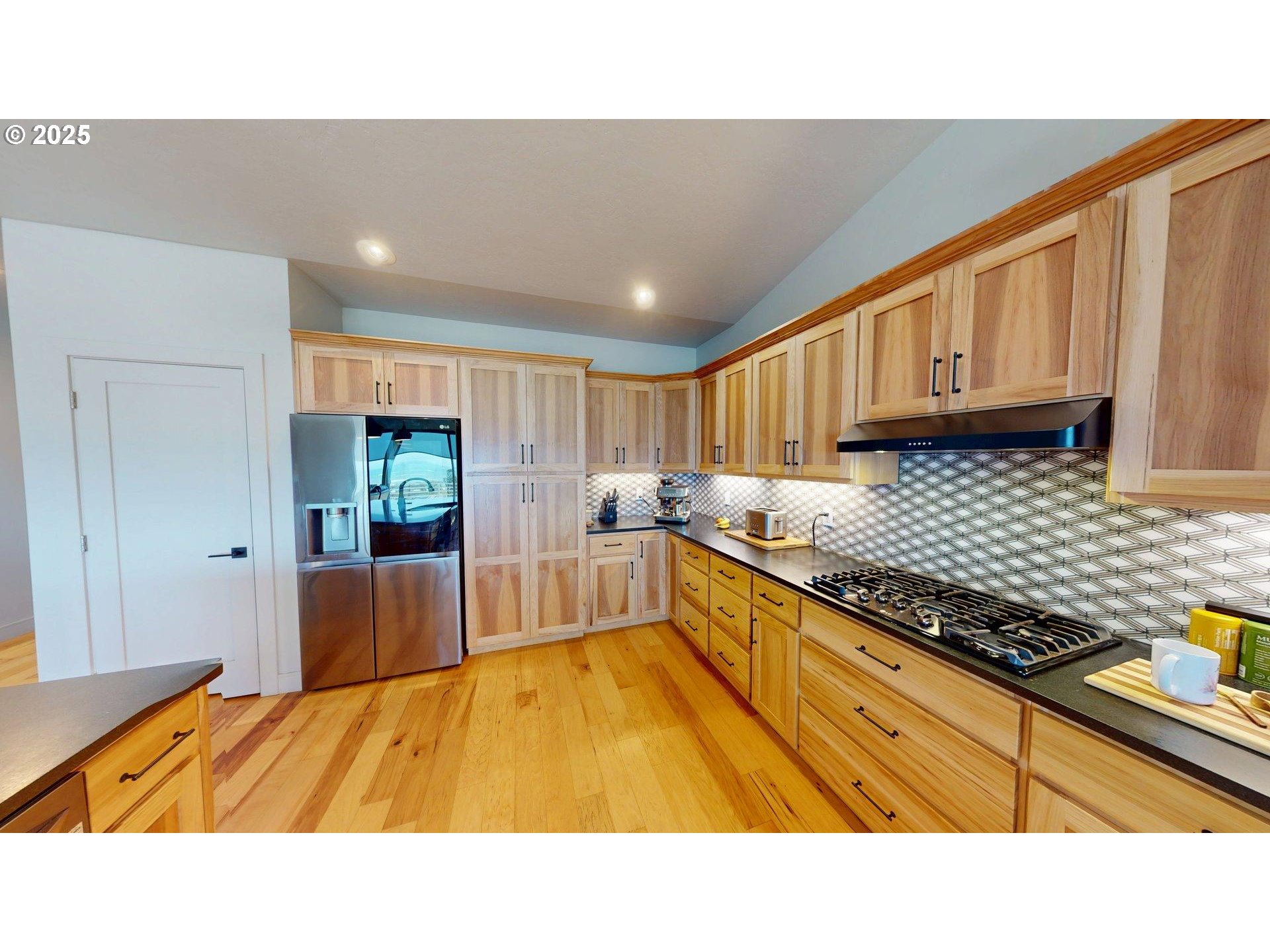 30420 Sawyer Way Gold Beach, OR 97444 - Photo 10 of 47 a kitchen with stainless steel appliances granite countertop a sink stove and cabinets