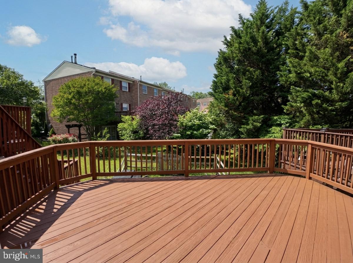 3614 Fawn Spring Court Baltimore, MD 21234 - Photo 17 of 22 a view of balcony with wooden floor and fence