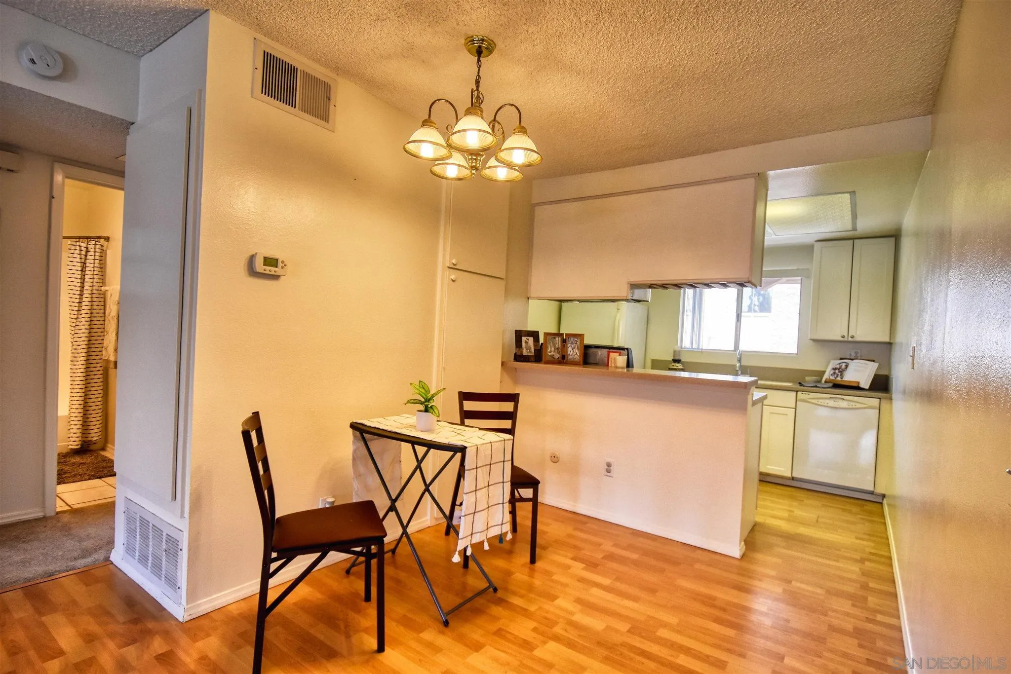 a kitchen with a table and chairs in it