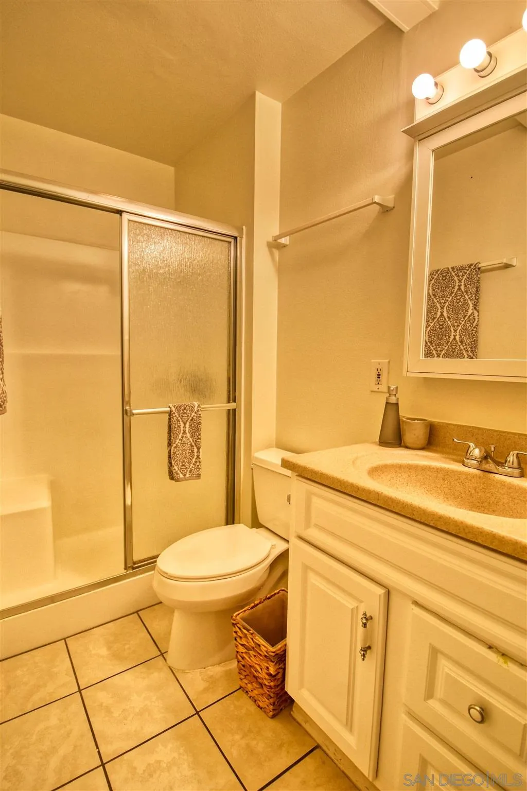 6069 Rancho Mission Road, Unit 202 San Diego, CA 92108 - Photo 14 of 26 a bathroom with a sink a toilet and shower