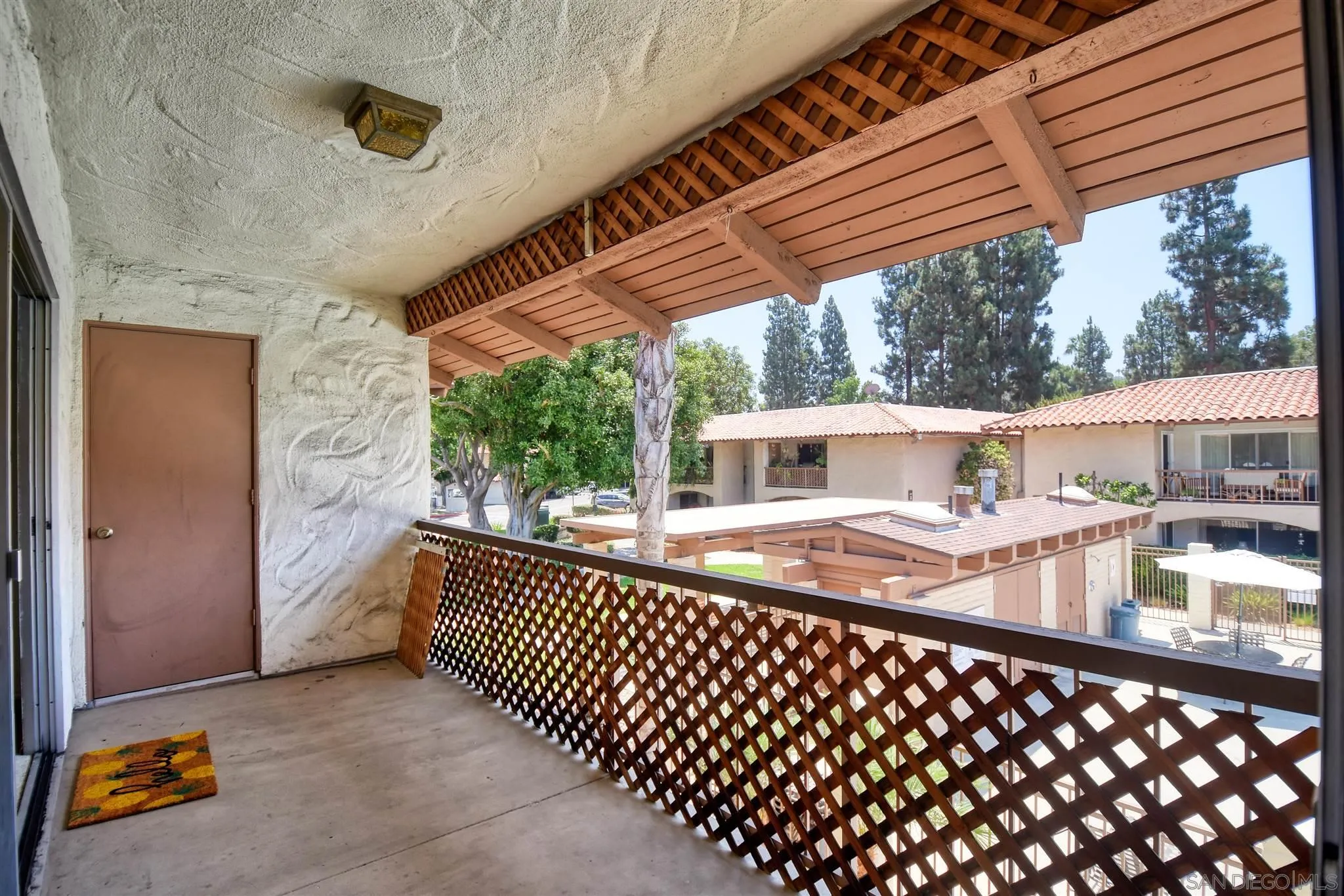 6069 Rancho Mission Road, Unit 202 San Diego, CA 92108 - Photo 21 of 26 a balcony view with a seating space