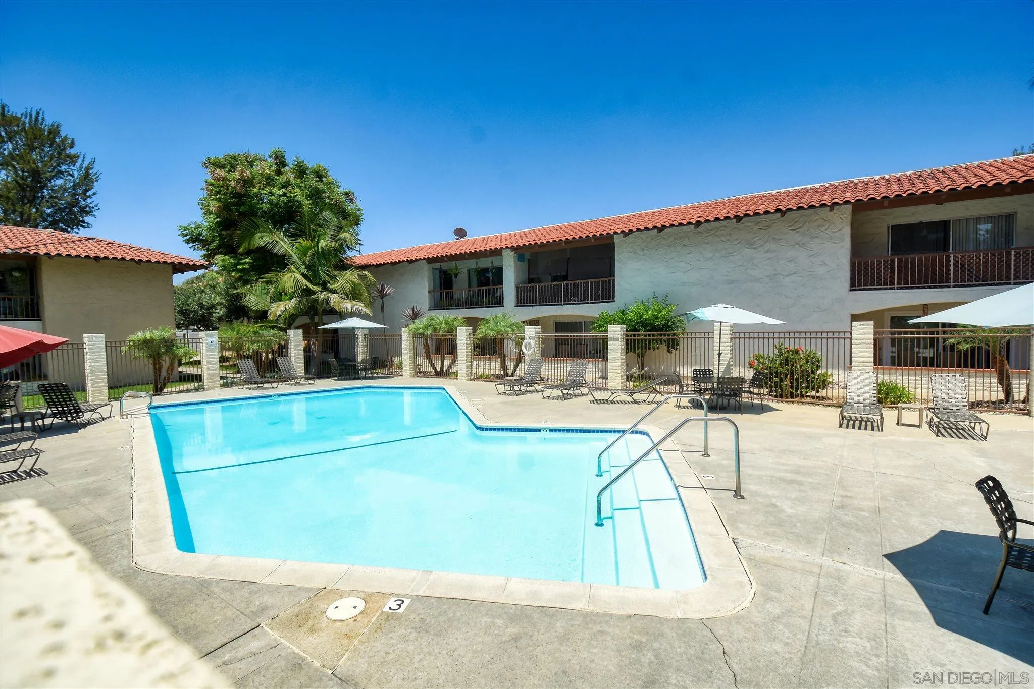 6069 Rancho Mission Road, Unit 202 San Diego, CA 92108 - Photo 22 of 26 a view of a swimming pool with a patio