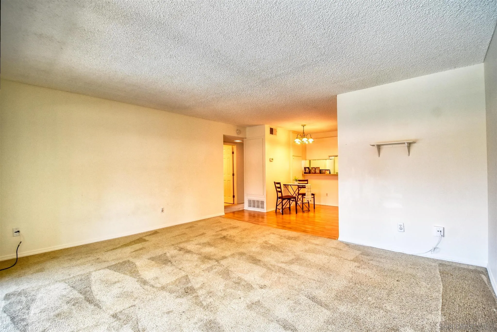 6069 Rancho Mission Road, Unit 202 San Diego, CA 92108 - Photo 9 of 26 an empty room with table and chairs