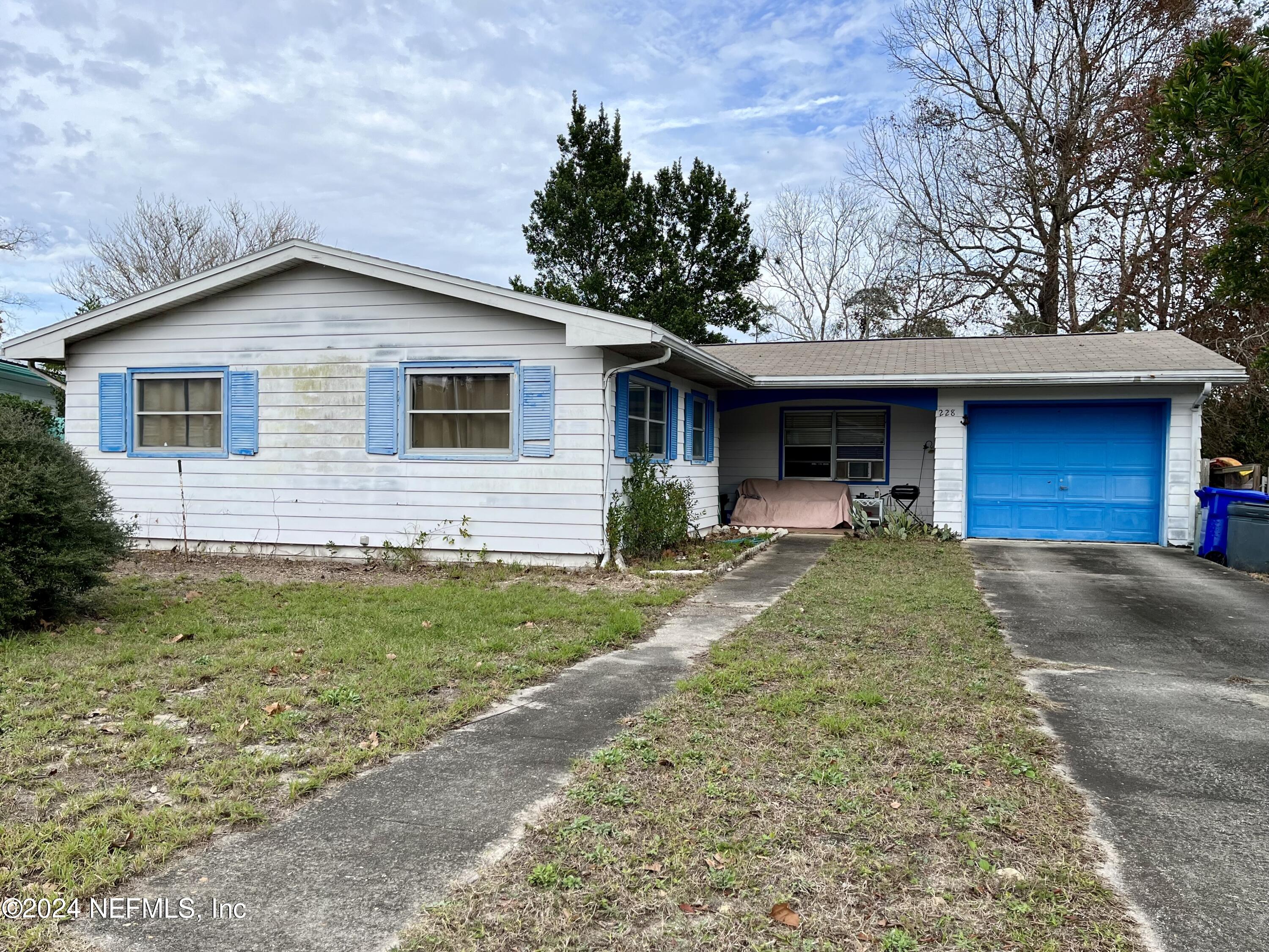 228 Lily Road St. Augustine, FL 32086 - Photo 1 of 34 a view of a house with backyard