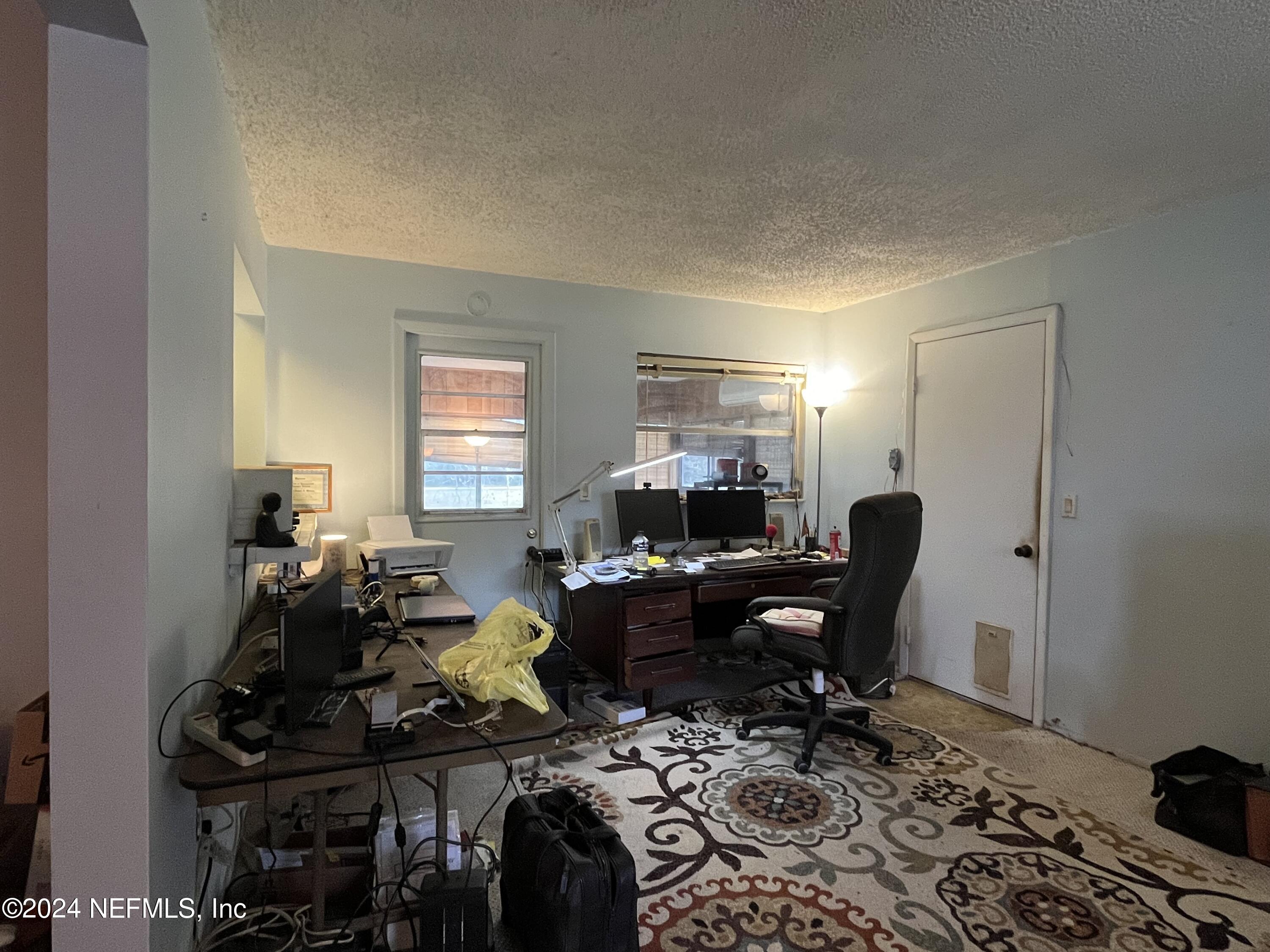 228 Lily Road St. Augustine, FL 32086 - Photo 13 of 34 a living room with furniture a piano and a window