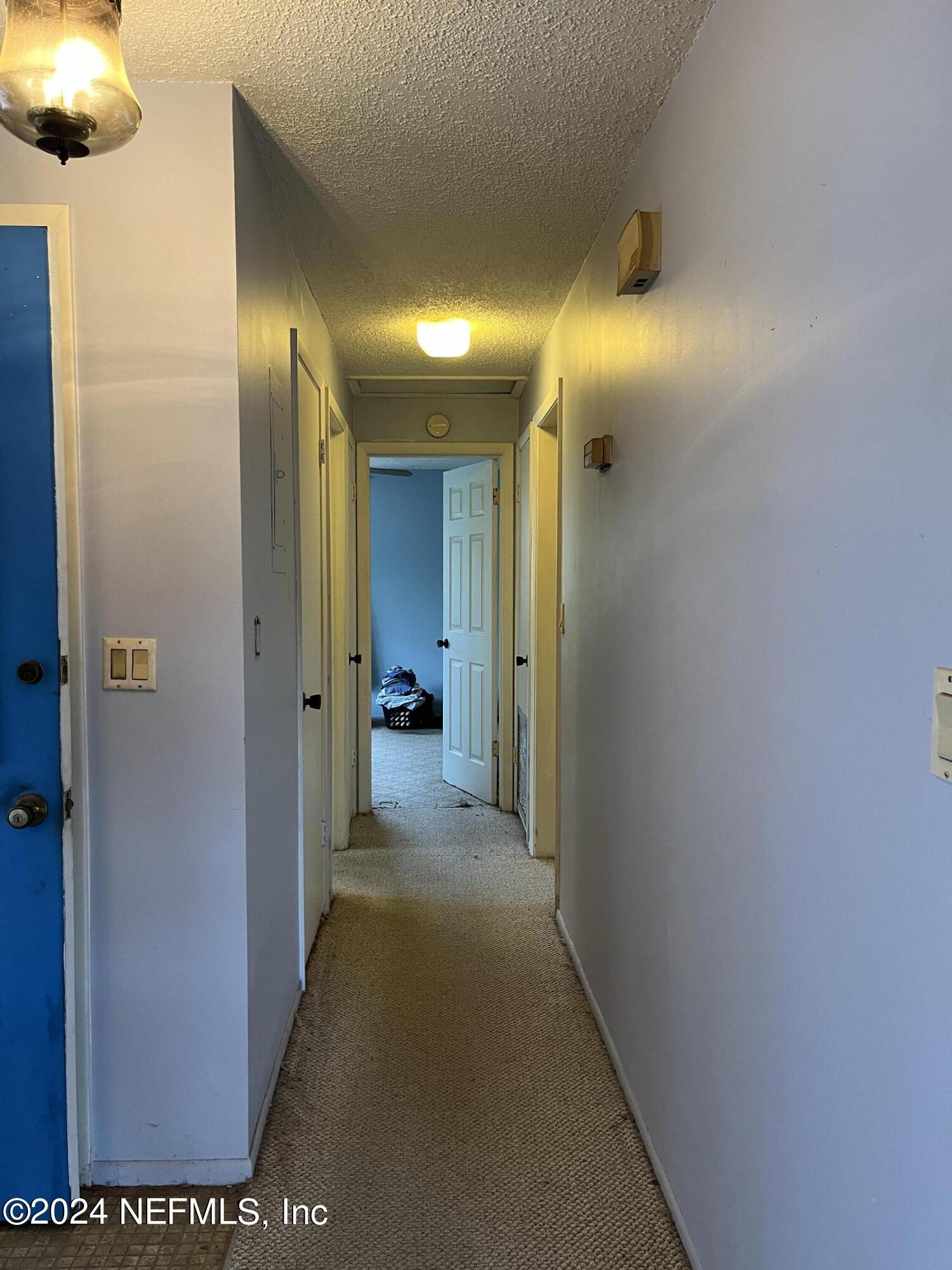 228 Lily Road St. Augustine, FL 32086 - Photo 16 of 34 a view of a hallway with a room