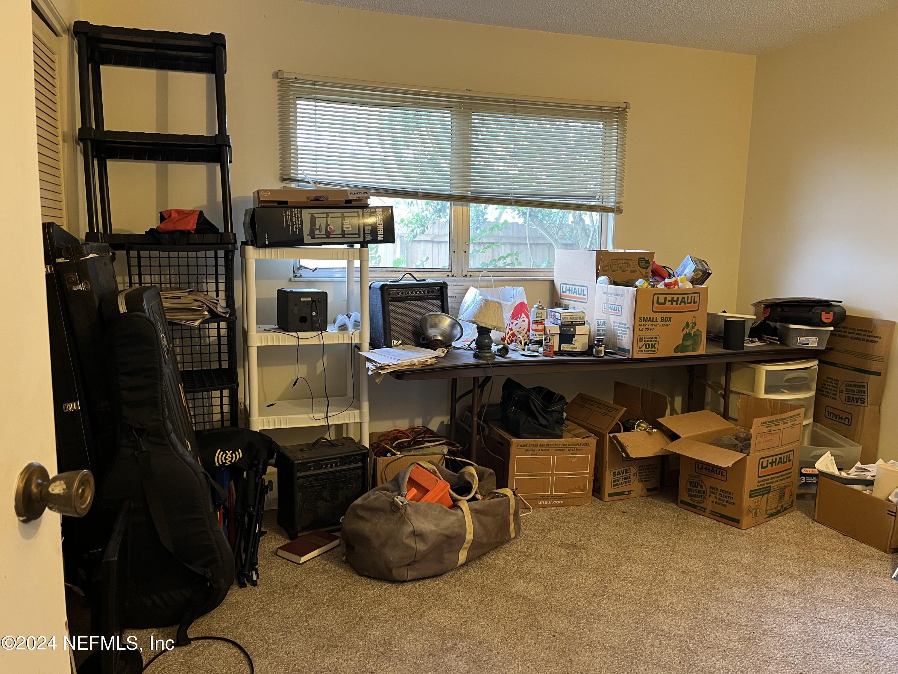 228 Lily Road St. Augustine, FL 32086 - Photo 17 of 34 a room with musical instruments