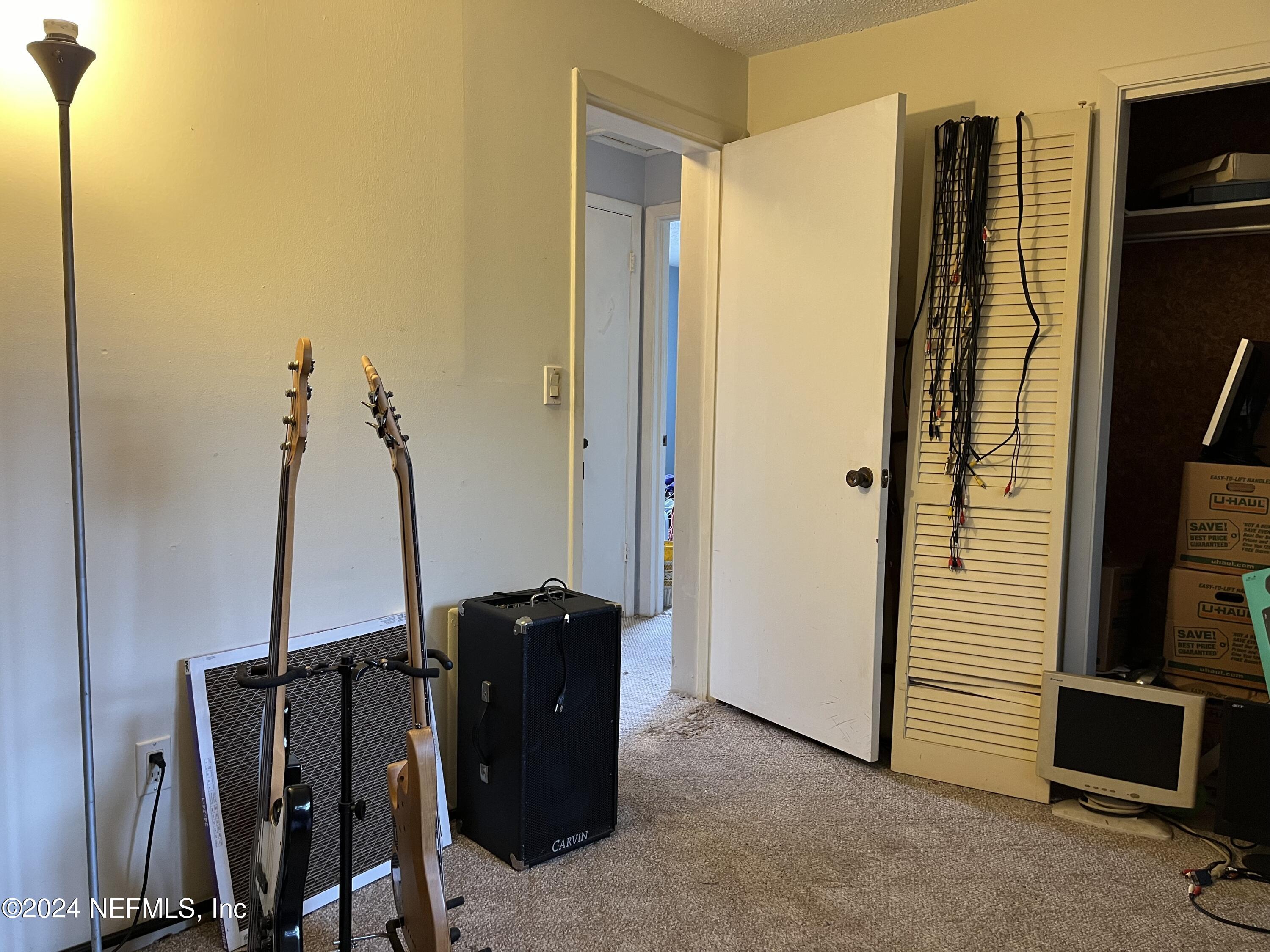 228 Lily Road St. Augustine, FL 32086 - Photo 19 of 34 a view of a room with gym equipment
