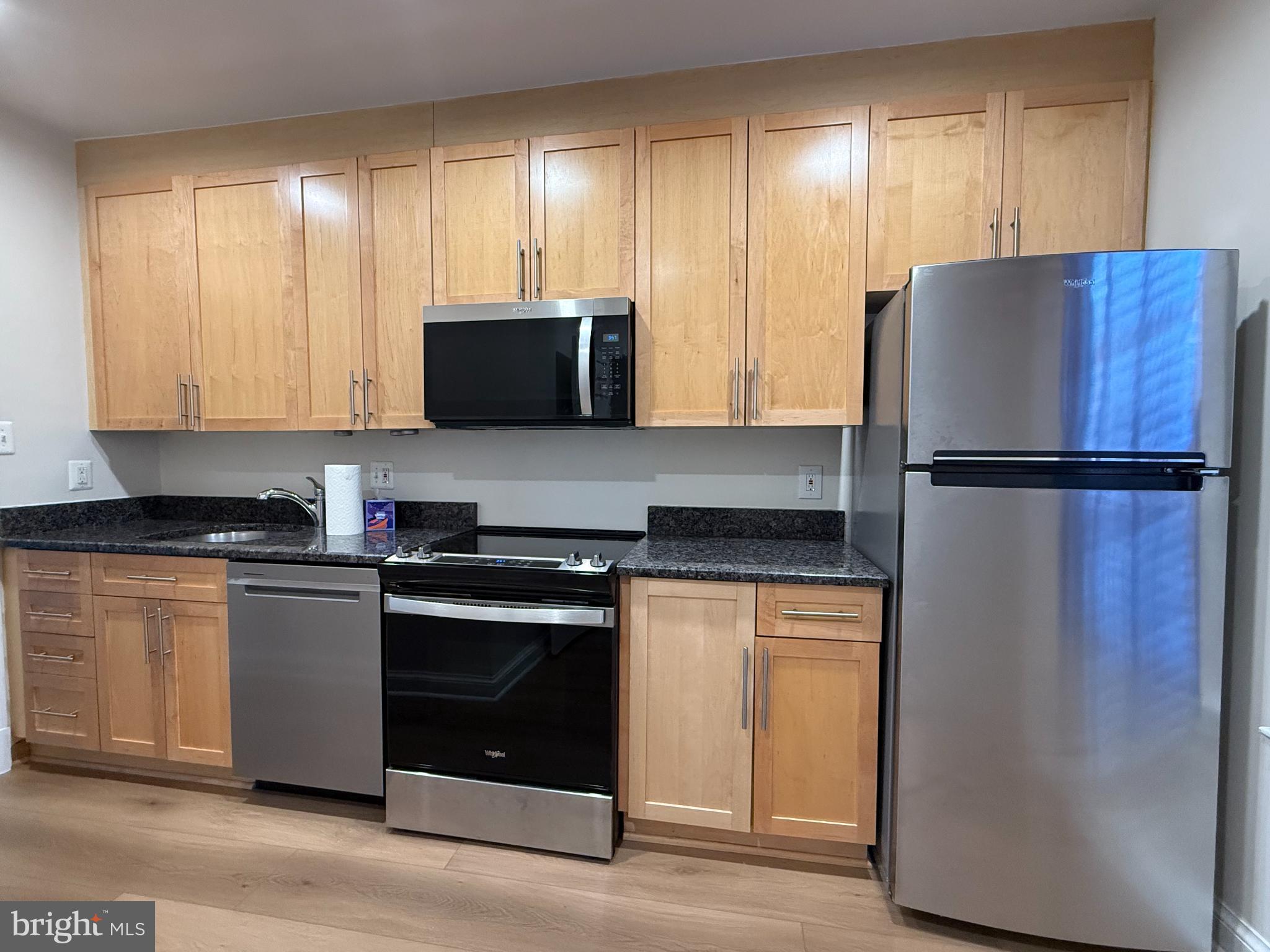1632 Beekman Place Northwest, Unit B Washington, DC 20009 - Photo 3 of 14 Modern kitchen with sleek finishes.