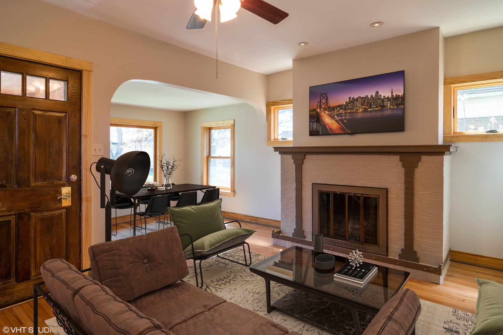 152 East Burlington Street Riverside, IL 60546 - Photo 3 of 10 a living room with furniture a fireplace and a flat screen tv