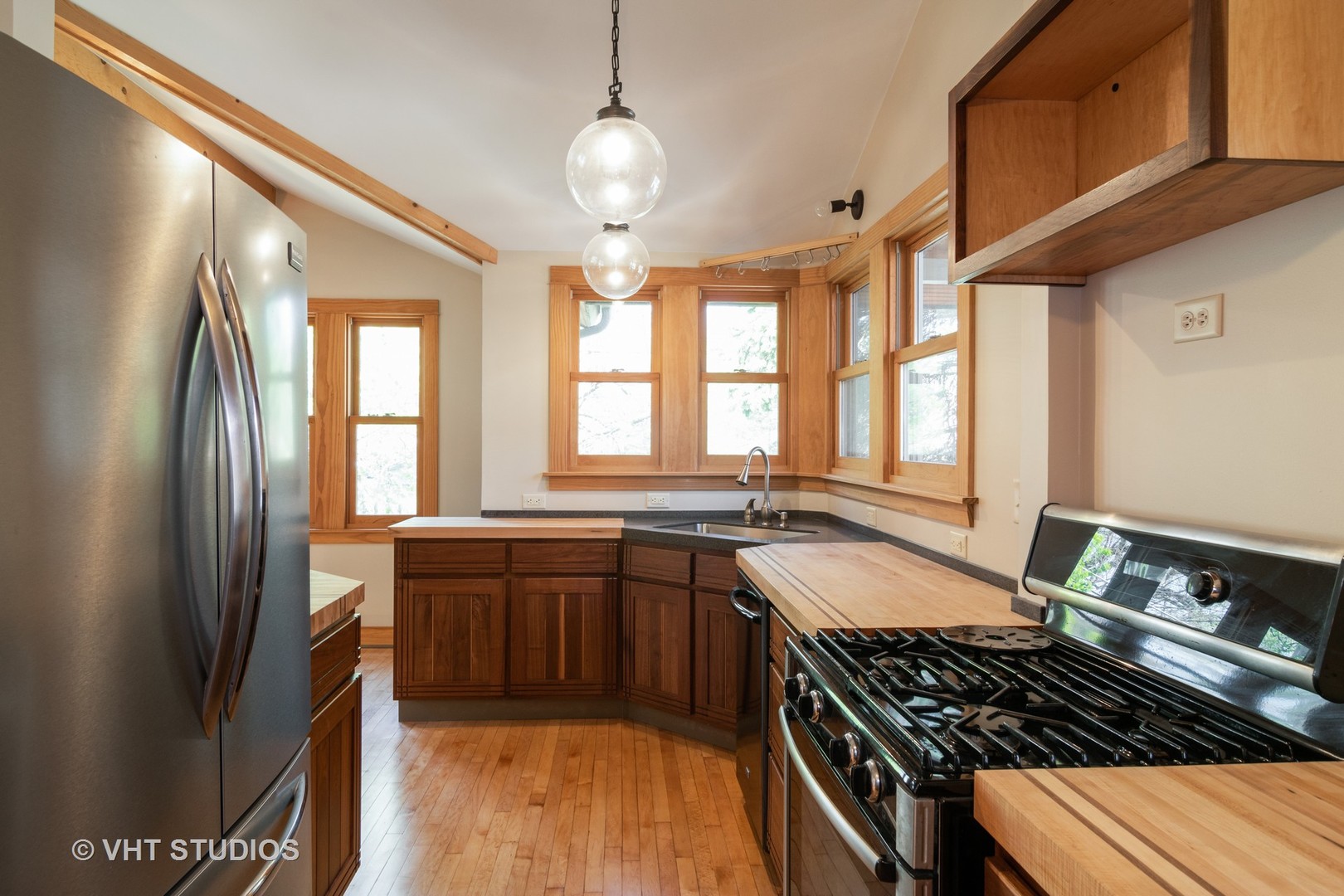 152 East Burlington Street Riverside, IL 60546 - Photo 5 of 10 a kitchen with stainless steel appliances granite countertop a stove a sink dishwasher and a refrigerator