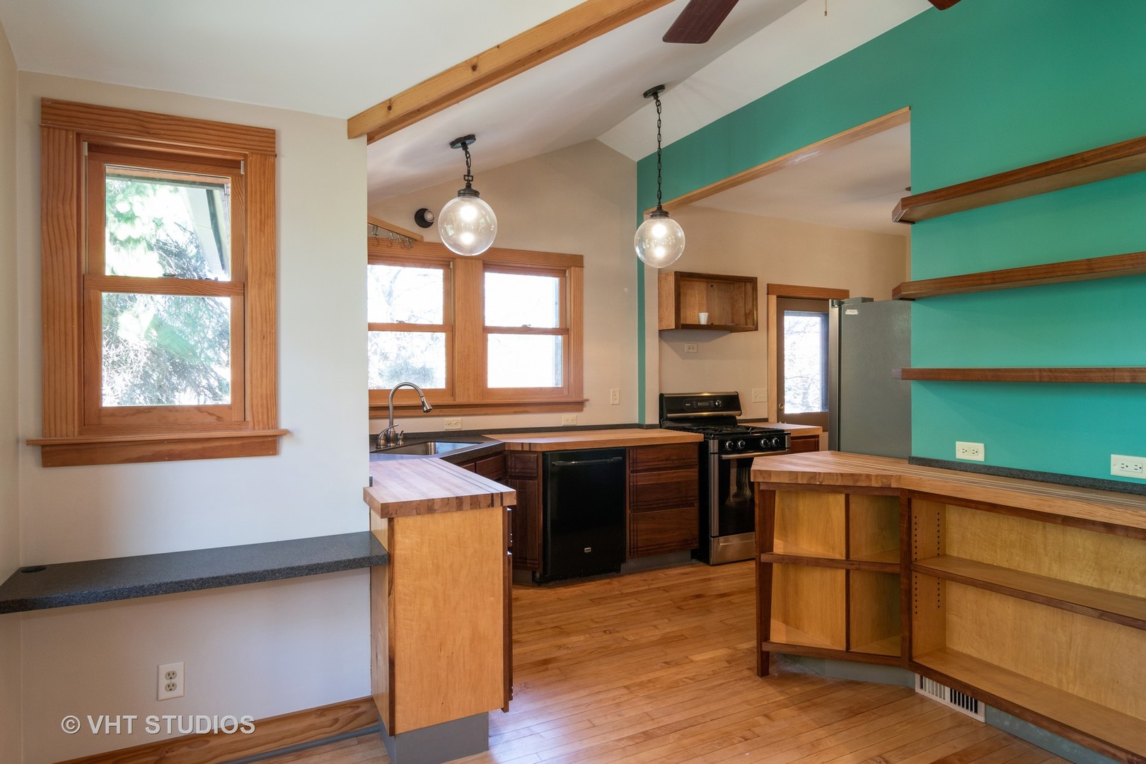 152 East Burlington Street Riverside, IL 60546 - Photo 6 of 10 a kitchen with a stove a sink and a microwave