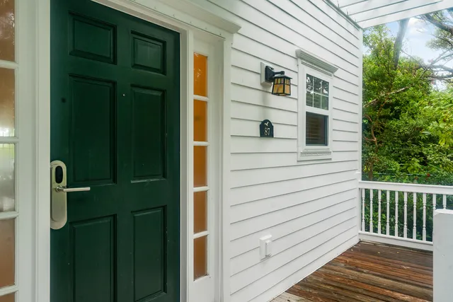a kitchen with granite countertop a refrigerator a stove and a sink