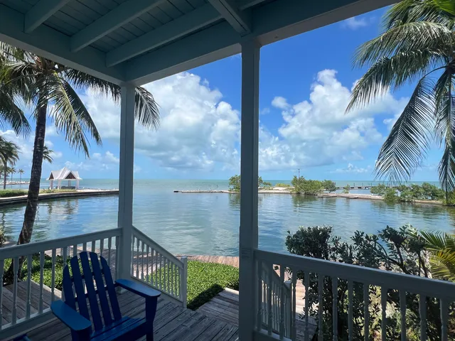 a kitchen with stainless steel appliances a refrigerator and a stove top oven