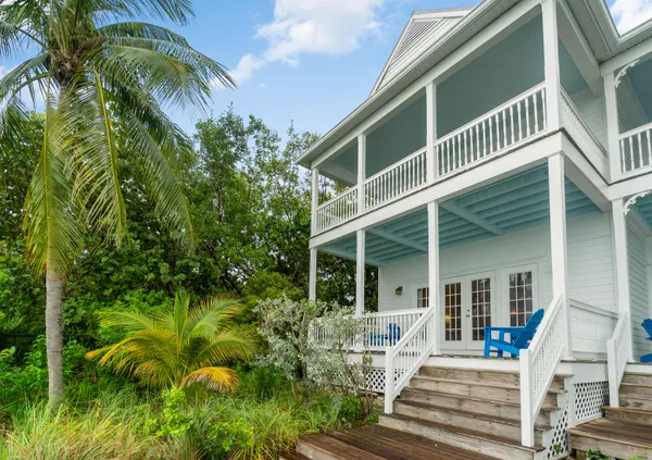 a view of a deck with wooden floor and fence