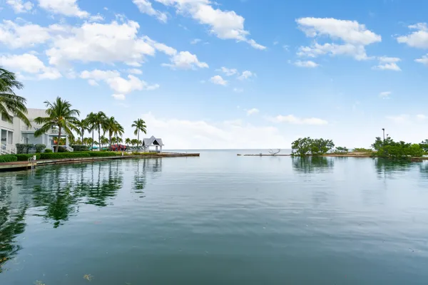 a bedroom with a bed and cabinets