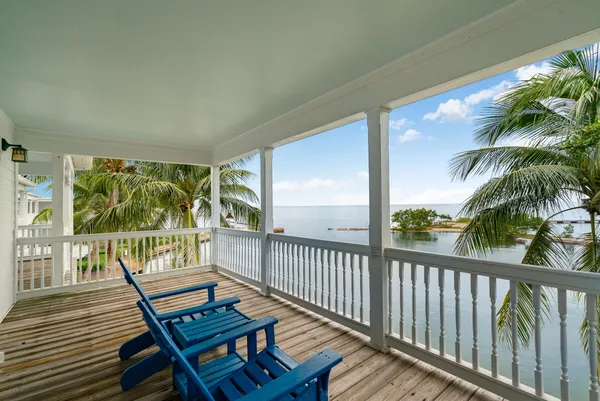 a view of a balcony with wooden floor