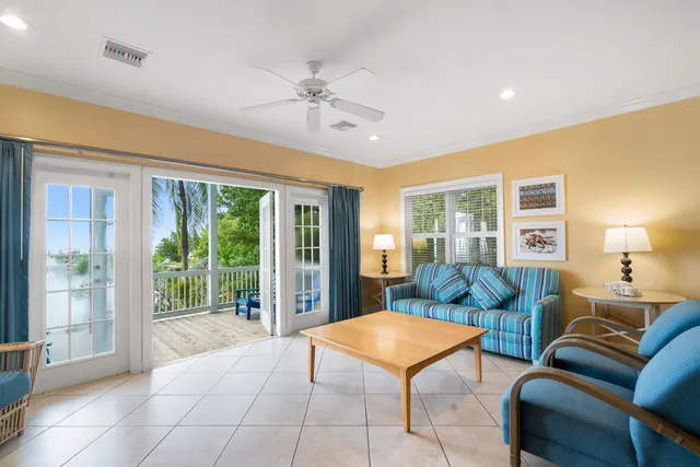 a view of a deck with wooden floor and fence