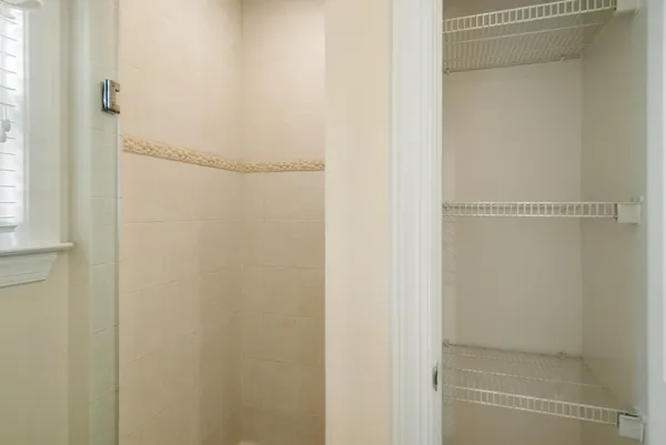 a bedroom with a bed and a lamp