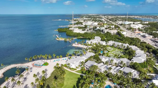 a view of residential houses with outdoor space and lake view