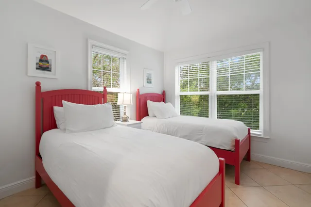 a living room filled with furniture and a book shelf