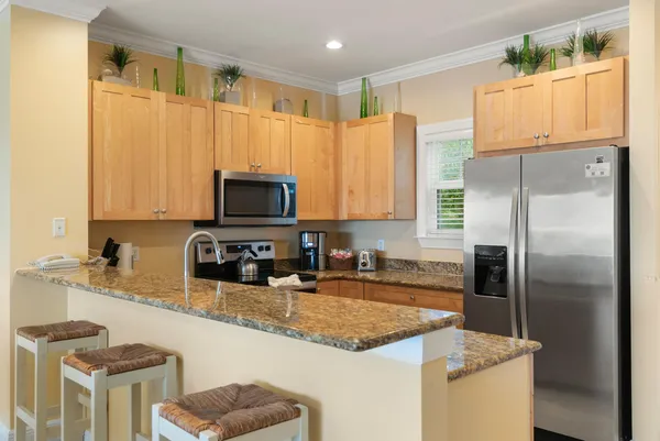 an aerial view of a house with outdoor space