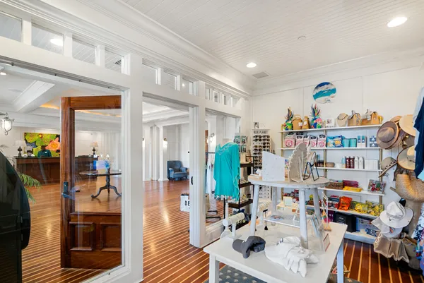 a living room filled with furniture and a book shelf