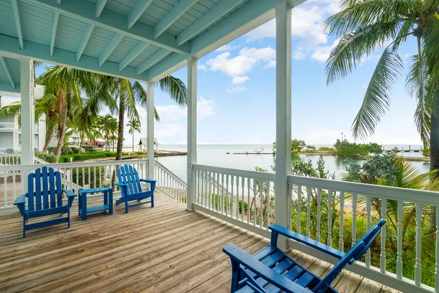 a view of a balcony with wooden floor