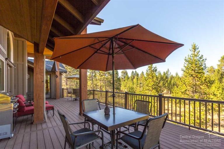 22 Oregon Loop Sunriver, OR 97707 - Photo 23 of 25 a view of a balcony with furniture and wooden floor