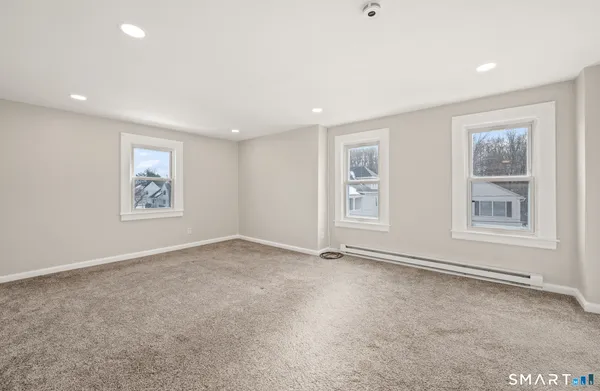 a view of an empty room with a window