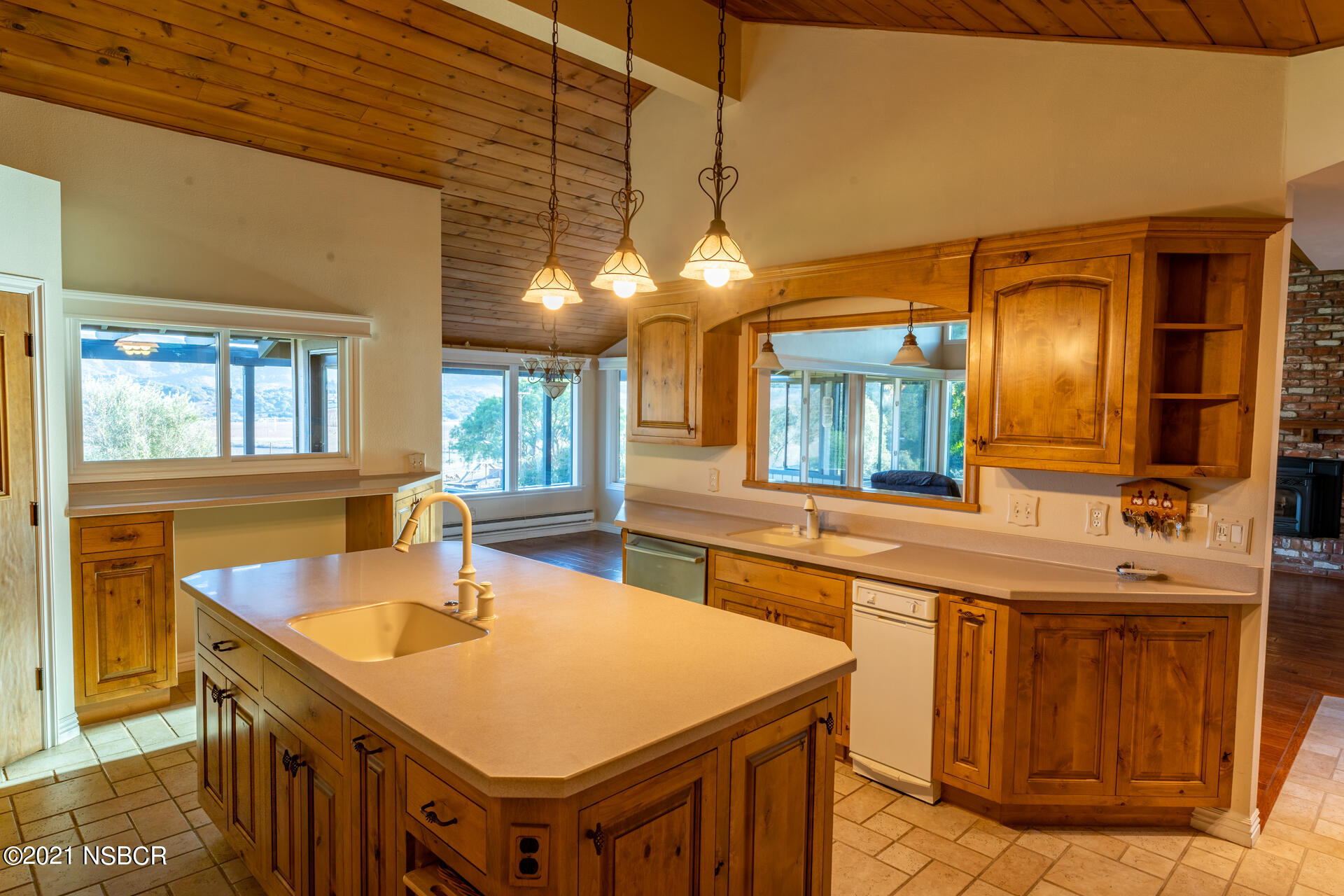 4281 Highway 246 Lompoc, CA 93436 - Photo 15 of 18 a kitchen with a sink a counter space and dining table