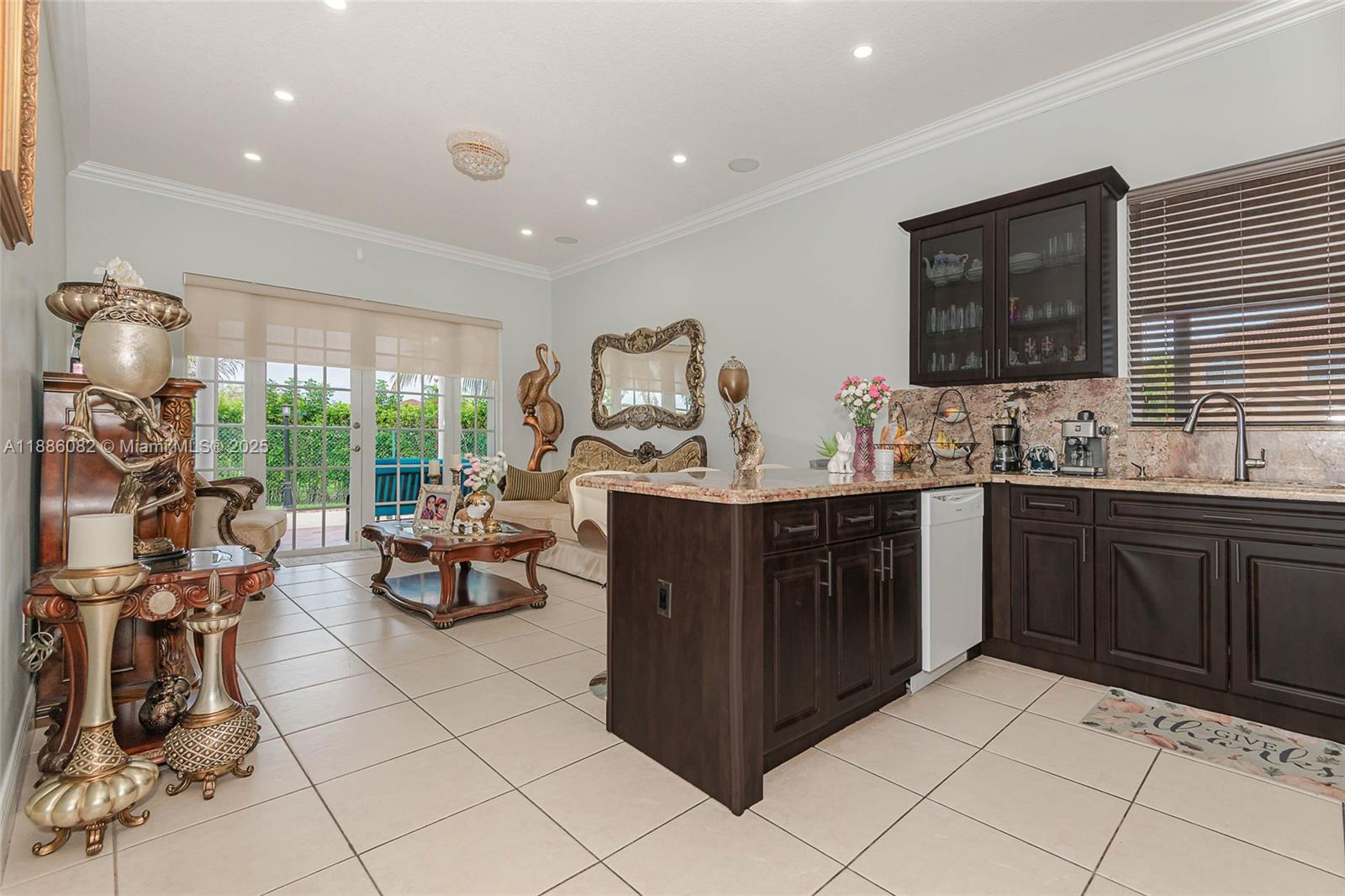 2911 Southwest 149th Place Miami, FL 33185 - Photo 14 of 33 a kitchen with a sink and cabinets
