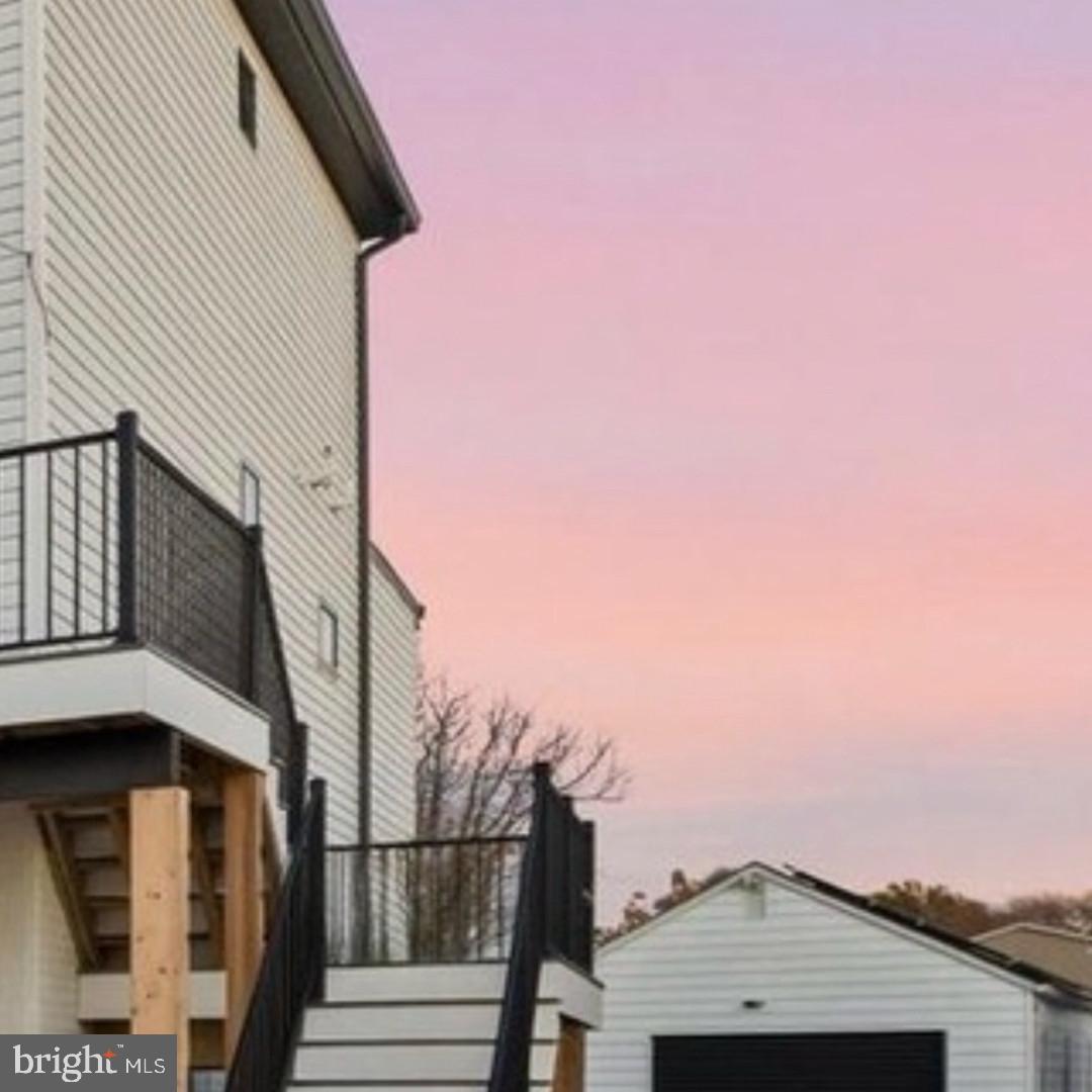 6931 River Drive Road Sparrows Point, MD 21219 - Photo 2 of 54 Charming home under a pastel sky.