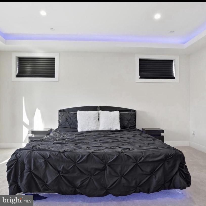 6931 River Drive Road Sparrows Point, MD 21219 - Photo 41 of 54 Sleek modern bedroom with ambient lighting.