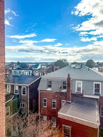 a view of a big house with a big yard
