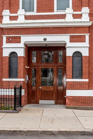 a view of front door and small windows