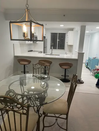 a kitchen with stainless steel appliances a sink and a refrigerator