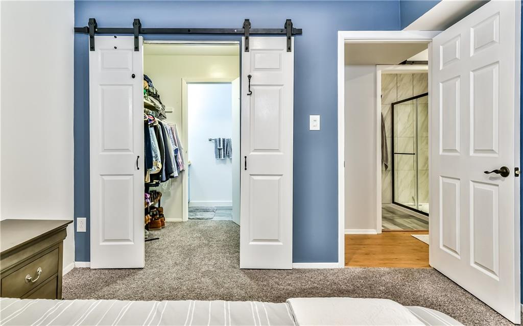 553 Sloop Road, Unit 38 Pittsburgh, PA 15237 - Photo 15 of 22 Master Bedroom closet and half bath with new barn doors and view of the full bath in the hall!