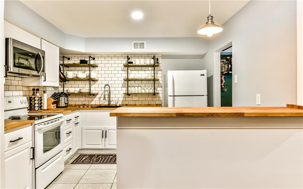 553 Sloop Road, Unit 38 Pittsburgh, PA 15237 - Photo 3 of 22 Magnificent new kitchen with new white cabinets, counter tops, ceramic tile backsplash and floating shelves!!!