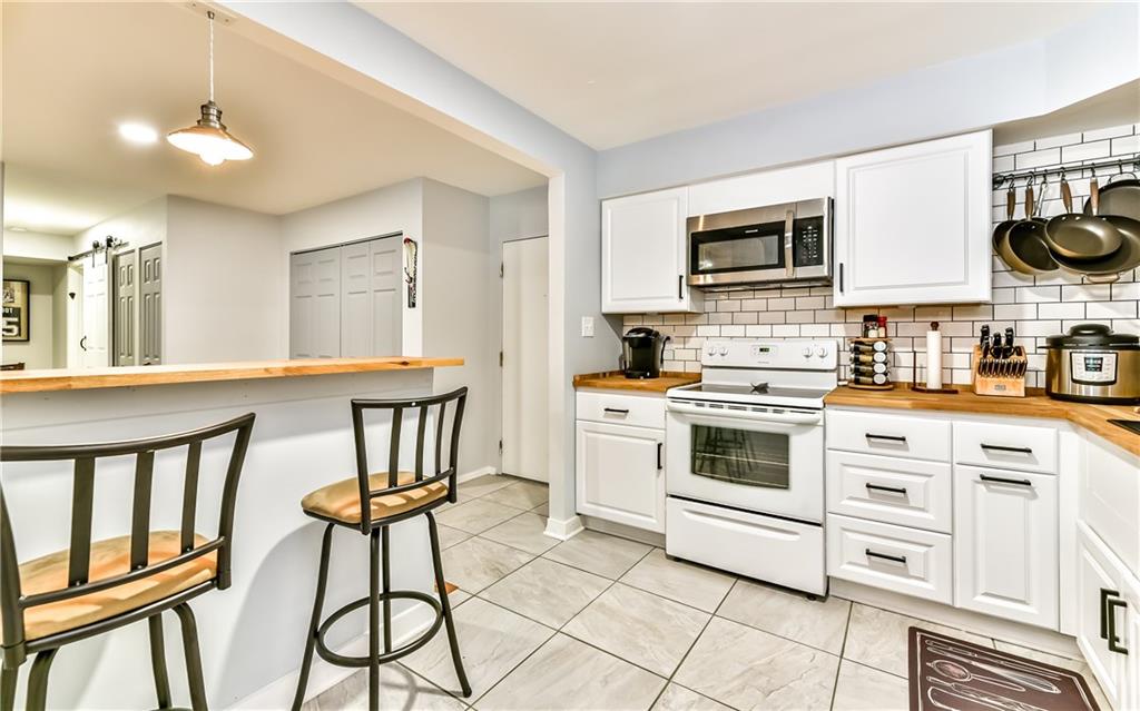 553 Sloop Road, Unit 38 Pittsburgh, PA 15237 - Photo 4 of 22 The kitchen wall has been opened up to provide a butcher block kitchen island!